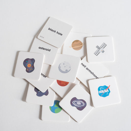 Space Pack tiles arranged loosely in a pile on white background