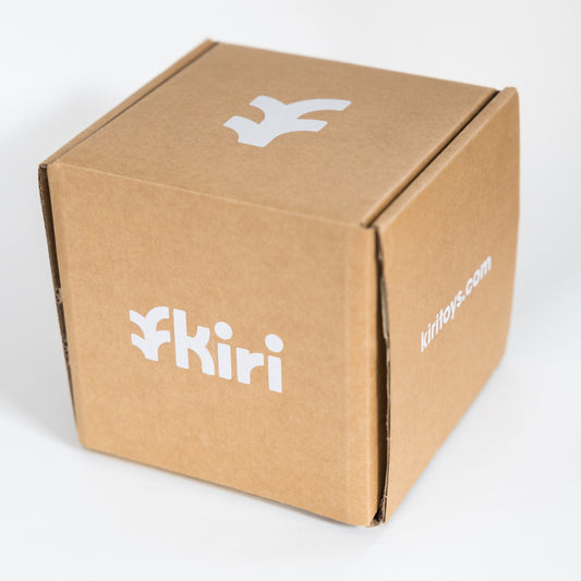 Small cardboard box with Kiri logo on each side containing the Kiri Smart Block