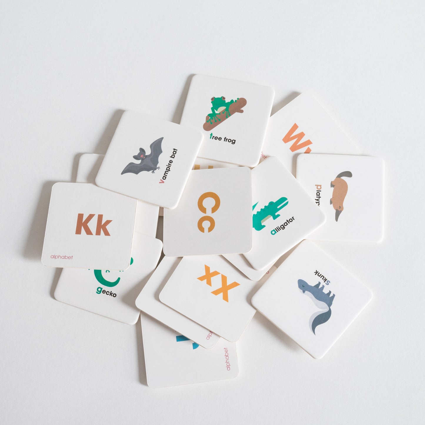 Alphabet Pack tiles arranged loosely in a pile on white background