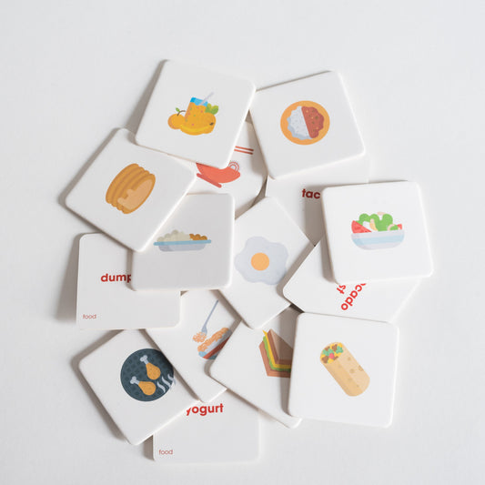 Food Pack tiles arranged loosely in a pile on white background