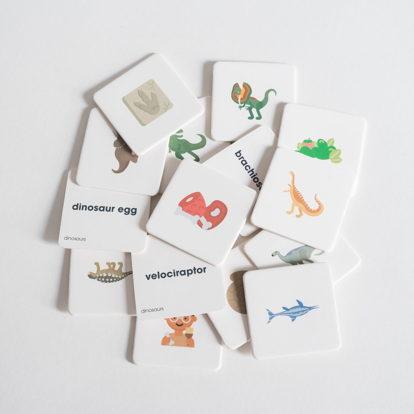 Dinosaurs Pack tiles arranged loosely in a pile on white background