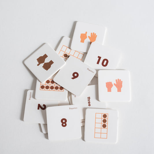 Counting Pack tiles arranged loosely in a pile on white background